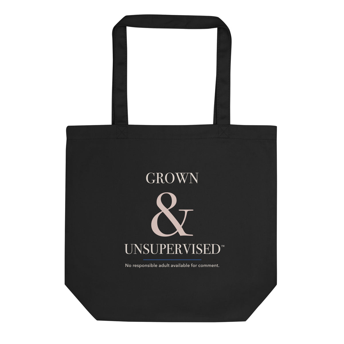 Black organic-cotton tote reading “Grown & Unsupervised™” in ivory, rosy-champagne, and royal-blue typography.