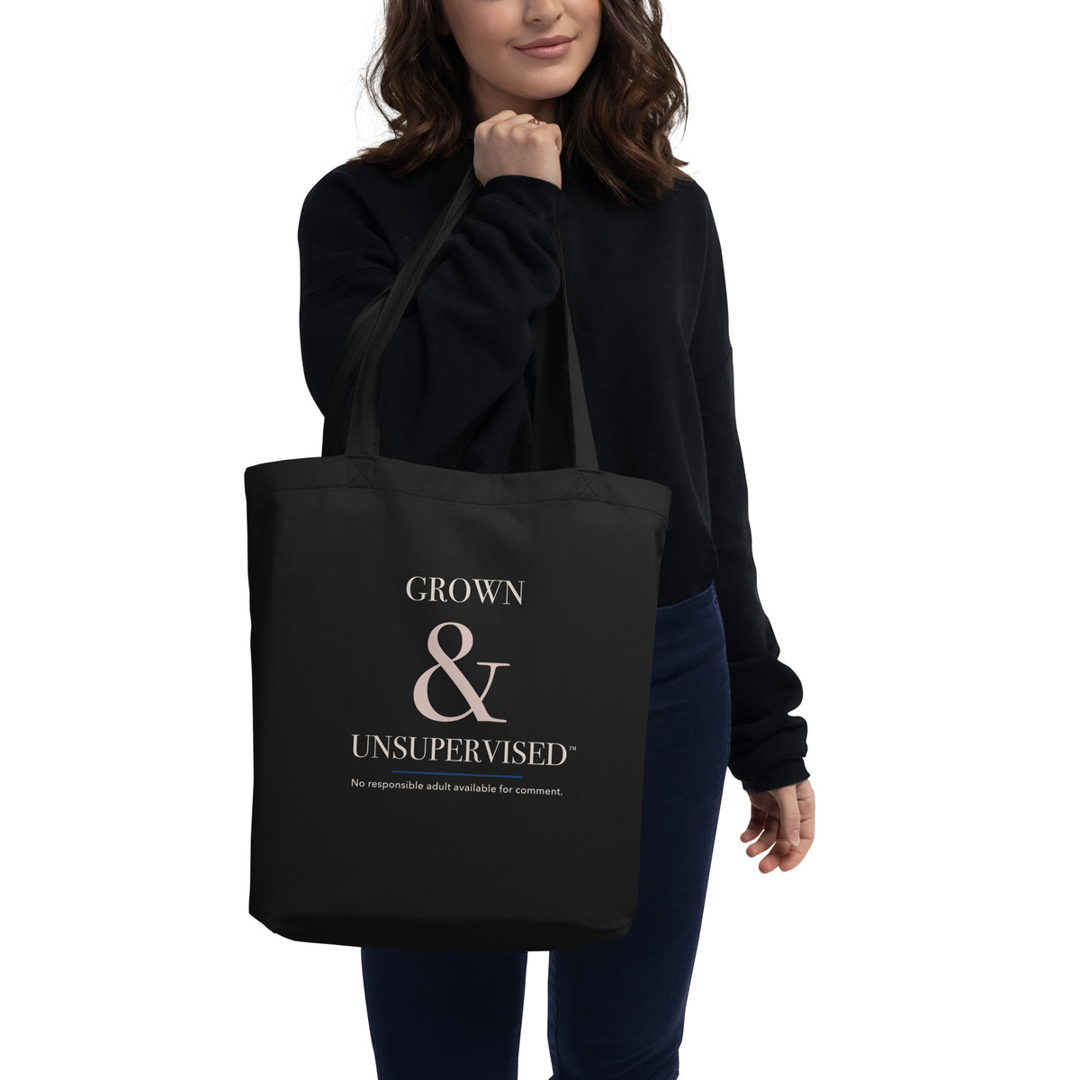 Model carrying the black Voluptuocity™ Grown & Unsupervised eco tote.