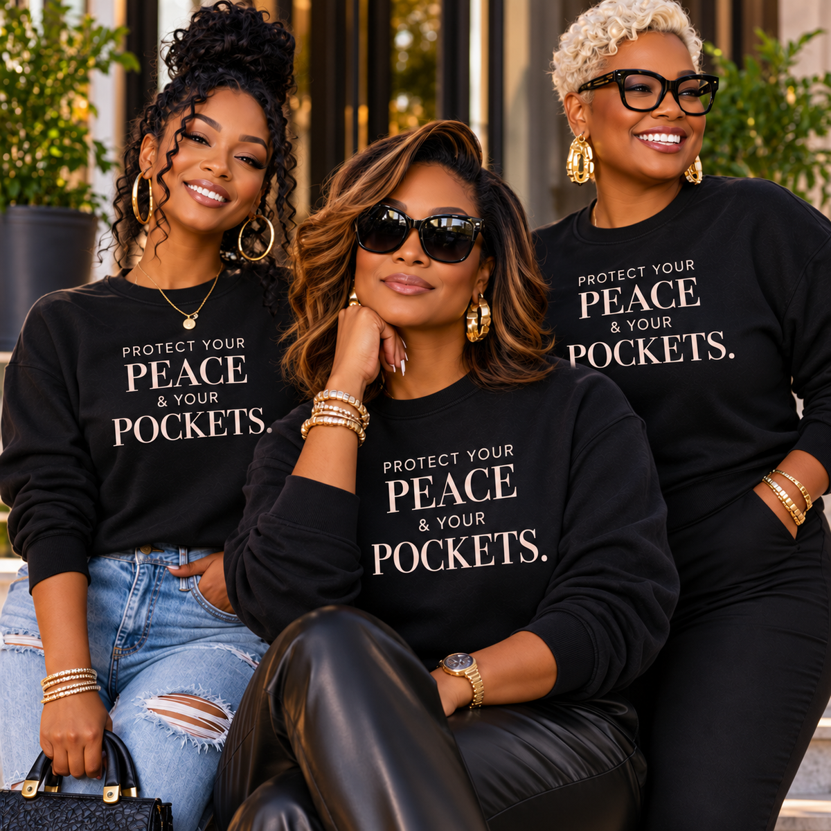 Three women wearing black Voluptuocity™ Protect Your Peace & Your Pockets crewneck sweatshirts styled with different everyday outfits.